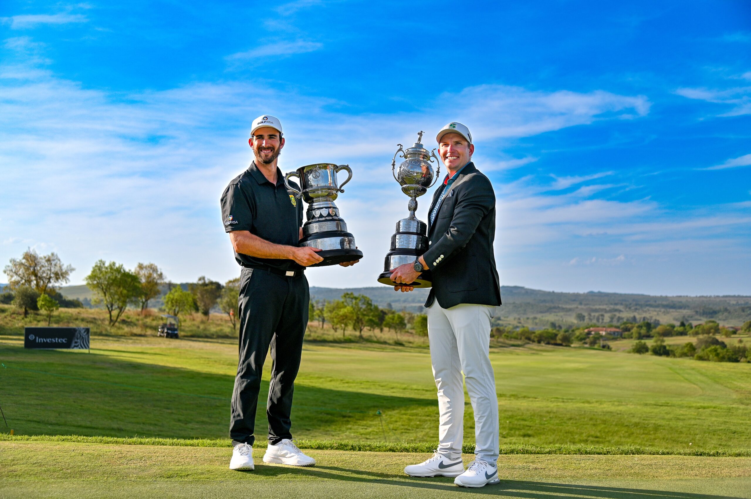 2023 Investec South African Open champion Dean Burmester and Leading Amateur Altin van der Merwe celebrate at Blair Atholl Golf and Equestrian Estate; credit GolfRSA.